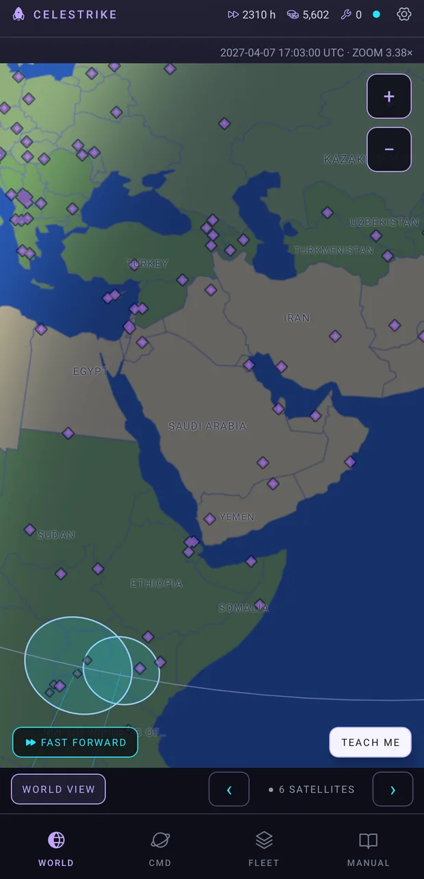 The WORLD screen zoomed to 3.4x over the Middle East and East Africa, with dozens of ground sites revealed as violet diamonds and two satellite footprints on the ground.